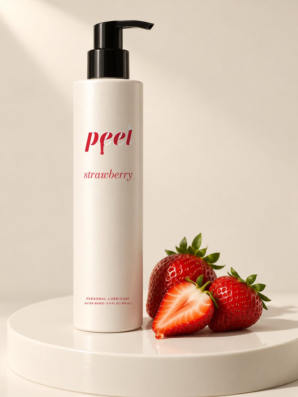 PEEL strawberry: a pearl sleeved bottle with red lettering on a pearl set, beside strawberries